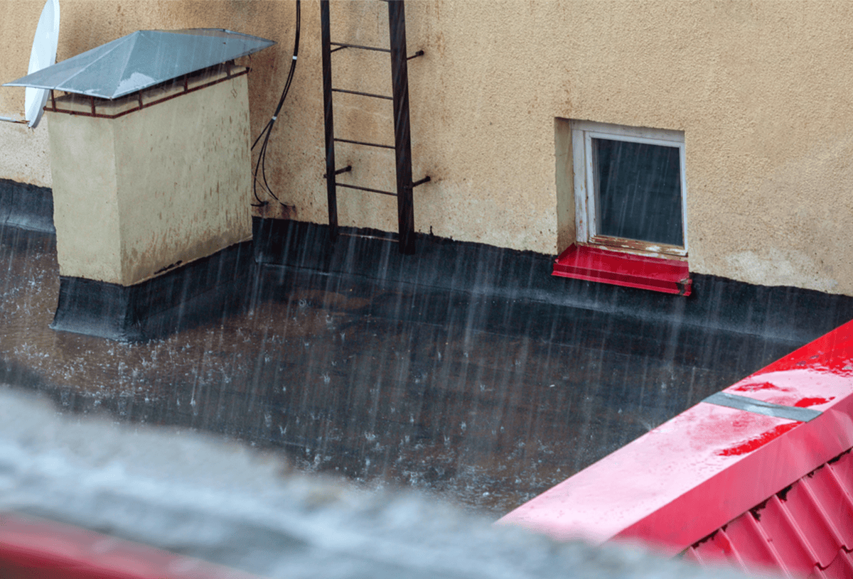 Commercial building rooftops in winter rain